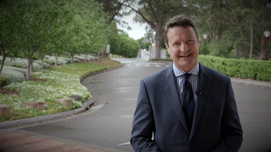 Headmaster Tony George speaking to camera
