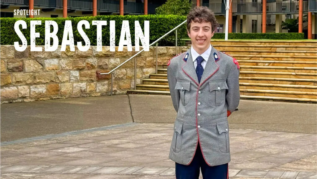 King's student standing in his number one uniform looking at the camera