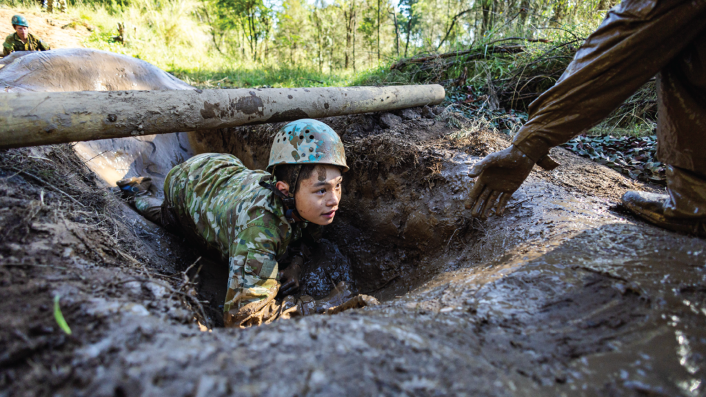 Boy navigating obstacle at Corps Camp.